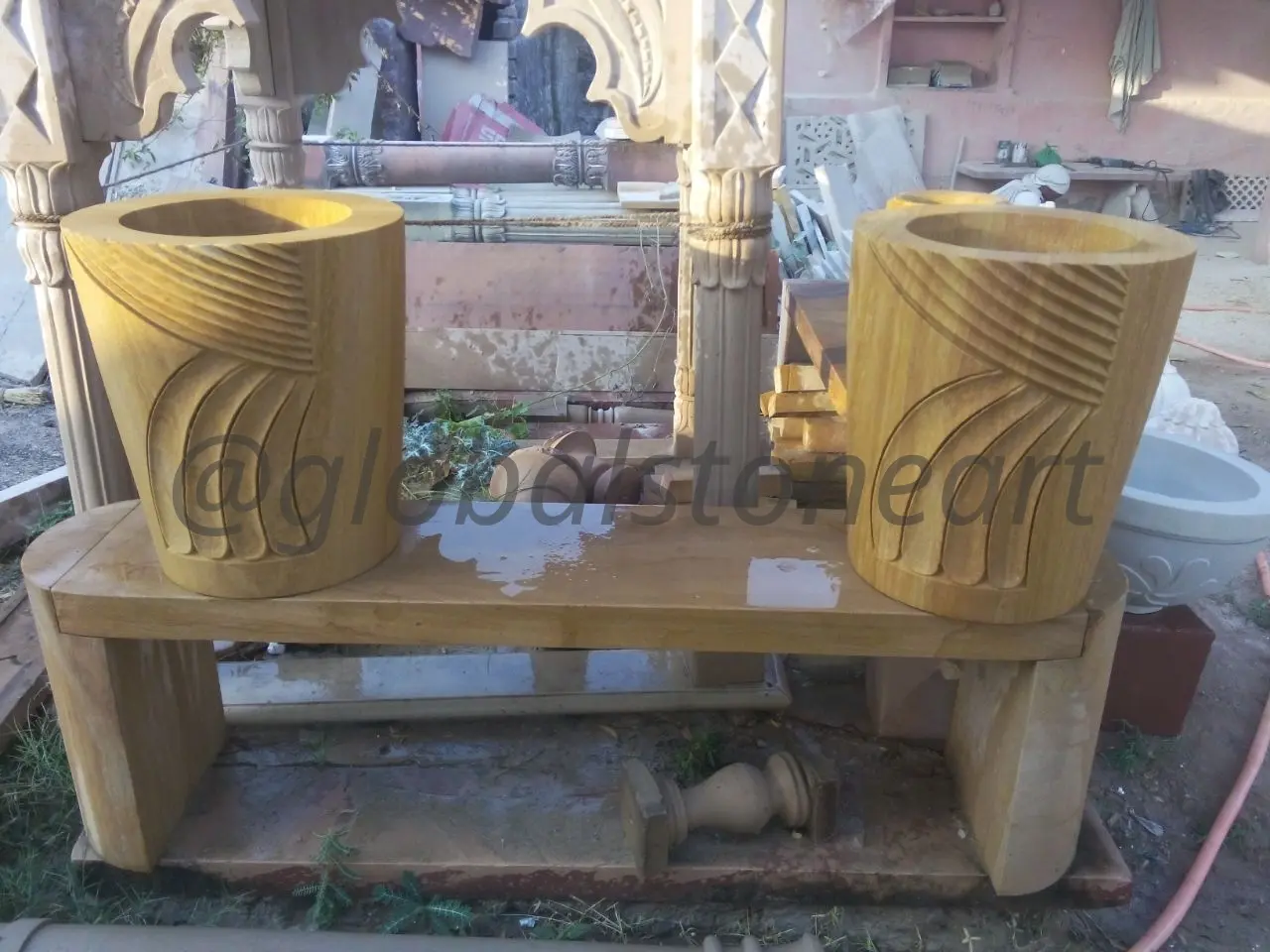 Wing-Carved Cylindrical Sandstone Planters (Pair)
