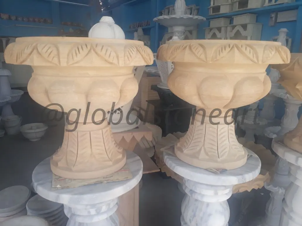 Leaf-Carved Sandstone Urn Planters on Fluted Base