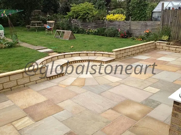 Buff Sandstone Patio with Raised Stone Wall for Lawn