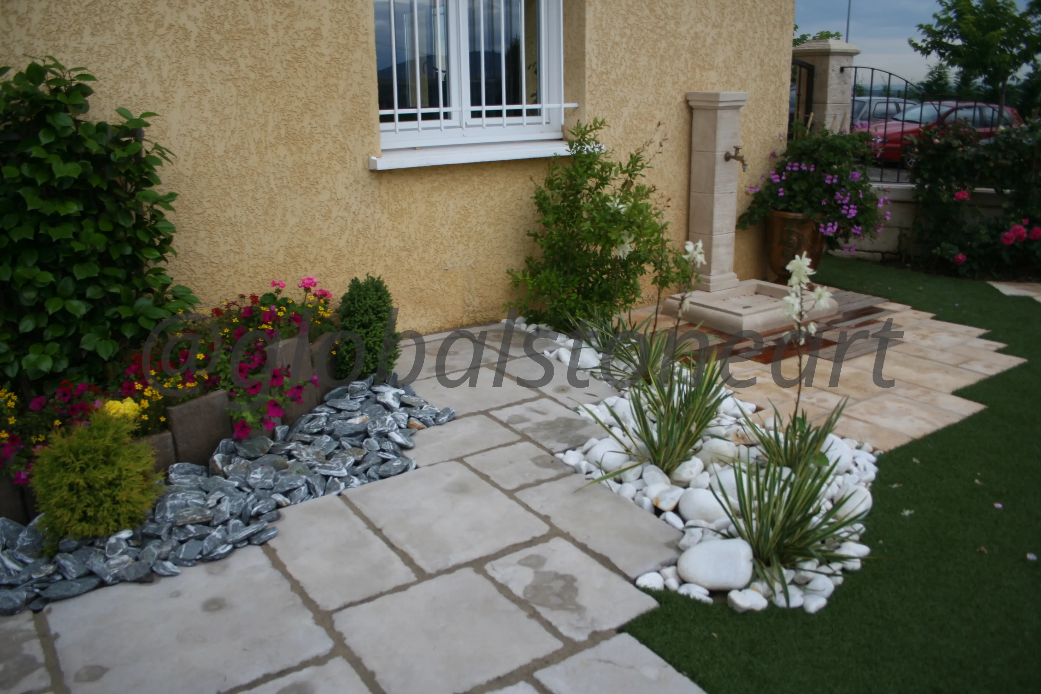Riven Sandstone Paving with Pebble and Plant Beds for Front Garden