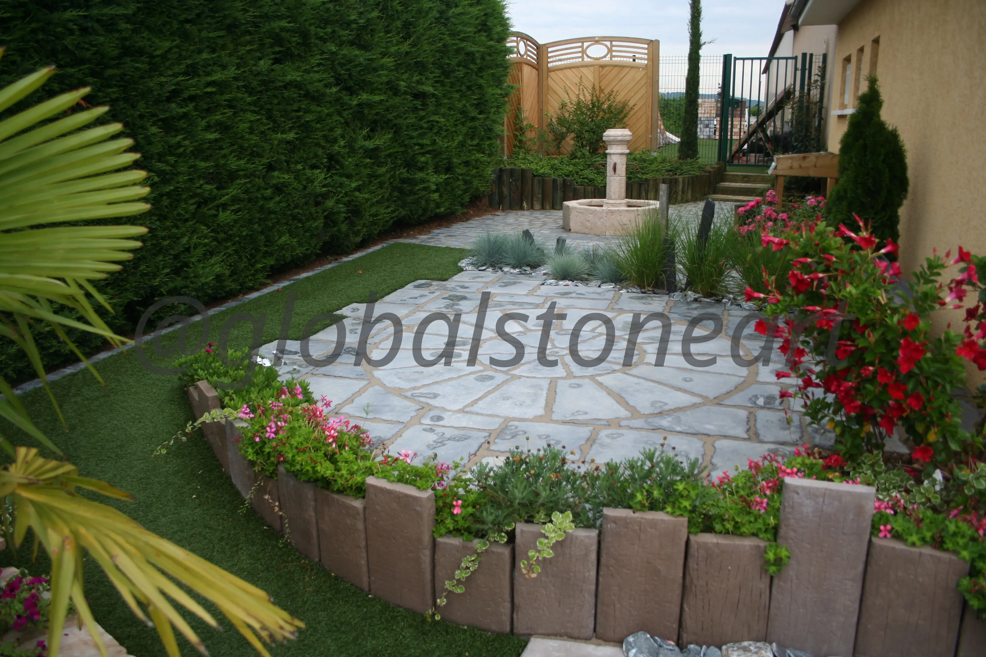 Grey Sandstone Crazy Paving Patio with Flower Borders