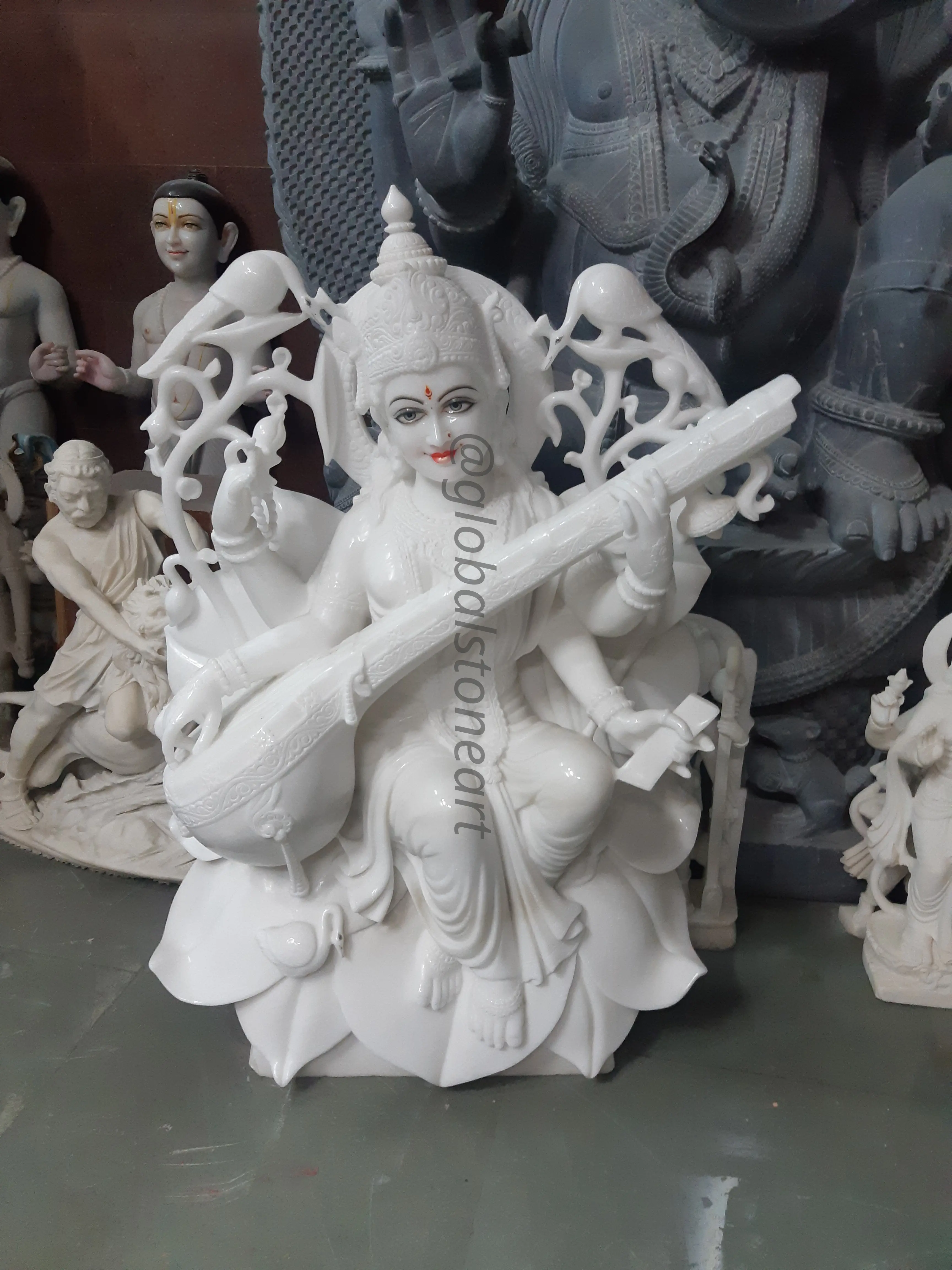 White Marble Saraswati Murti with Peacock Backrest